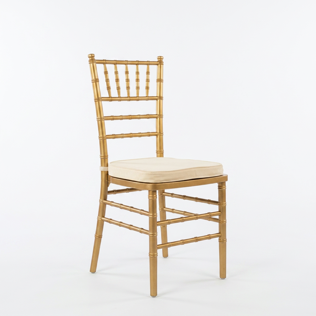 Gold chiavari chair with white cushion on wooden floor